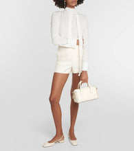 Valentino Garavani VLogo Signature patent leather slingback pumps