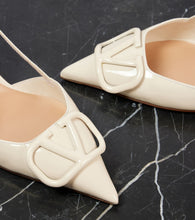 Valentino Garavani VLogo Signature patent leather slingback pumps