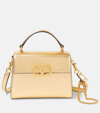 Valentino Garavani VSling Mini Swarovski√Ç¬Æ-embellished leather tote bag. Shop Valentino Garavani Top-Handle Bags for women now.