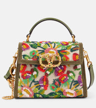 Valentino Garavani VSling Mini embellished jacquard tote bag. Shop Valentino Garavani Top-Handle Bags for women now.
