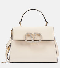 Valentino Garavani VSling Small embellished leather tote bag. Shop Valentino Garavani Top-Handle Bags for women now.
