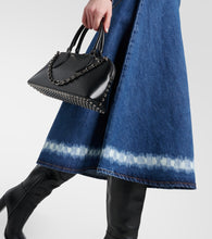 Valentino VGold distressed denim midi skirt