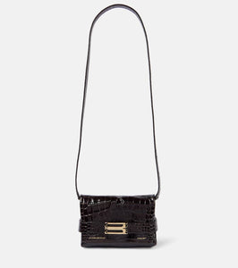 Victoria Beckham Mini croc-effect leather clutch. Shop Victoria Beckham Clutches for women now.