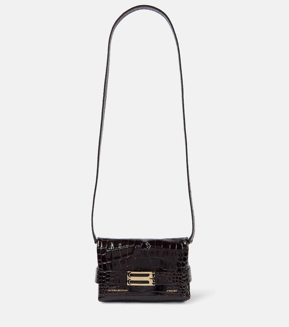 Victoria Beckham Mini croc-effect leather clutch. Shop Victoria Beckham Clutches for women now.