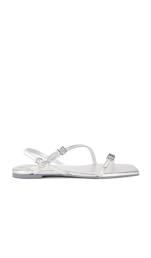 SIMKHAI Carey Metallic Strappy Flat Sandal in Metallic Silver, grey | Silver Strappy Sandals for Women