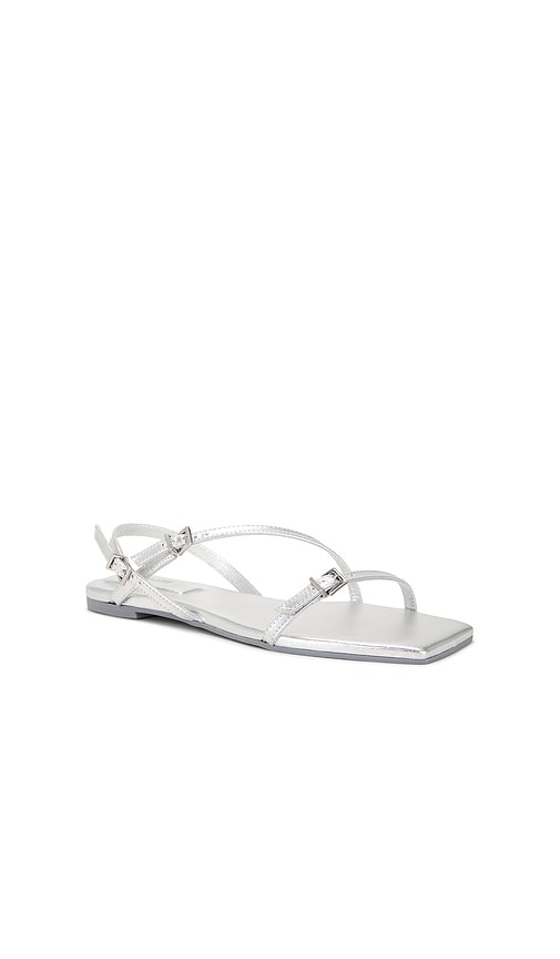 SIMKHAI Carey Metallic Strappy Flat Sandal in Metallic Silver, grey